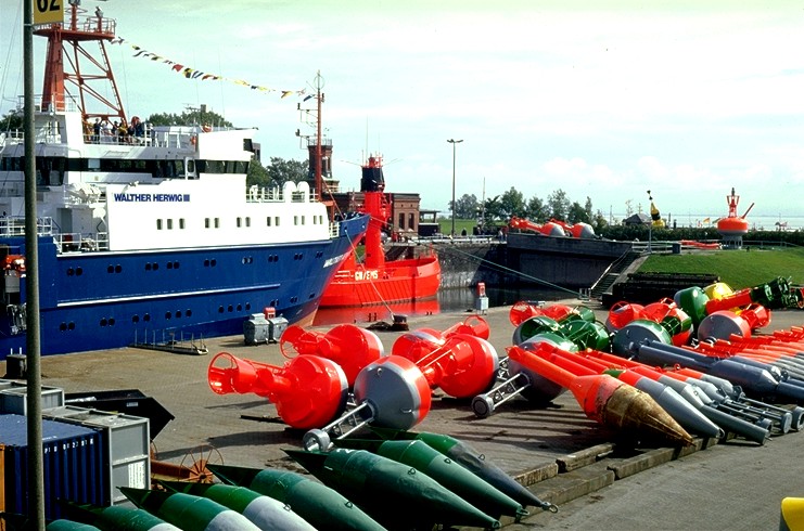 Colourful buoys and the research vessel