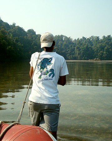 Aung trailing our boat into the shallow creek Aung trailing our boat into the shallow creek
