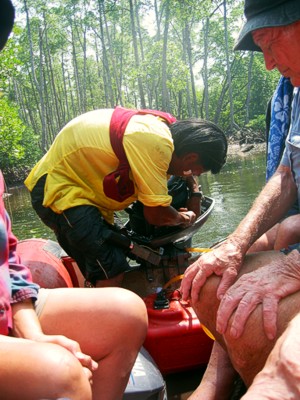 Cole fixing the outboarder